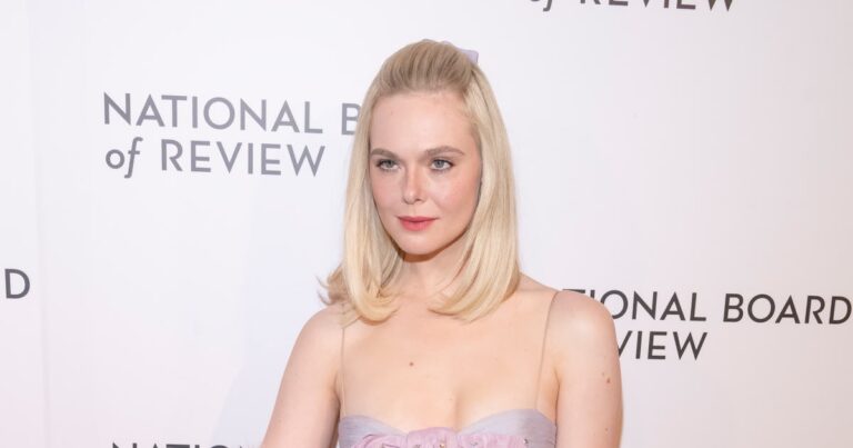 Elle Fanning Pairs a Baby-Doll Dress With Faux Fur and Blinding Rubies